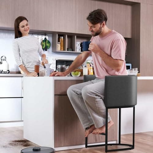Modern counter height bar stool with backrest and cushion seat.
